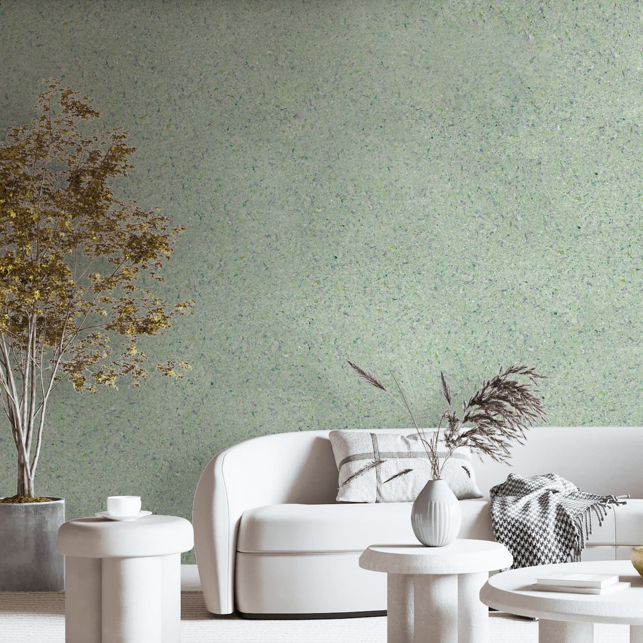 Tapet Belka verde pastel autoadeziv aplicat într-un living elegant cu canapea albă și decor natural.