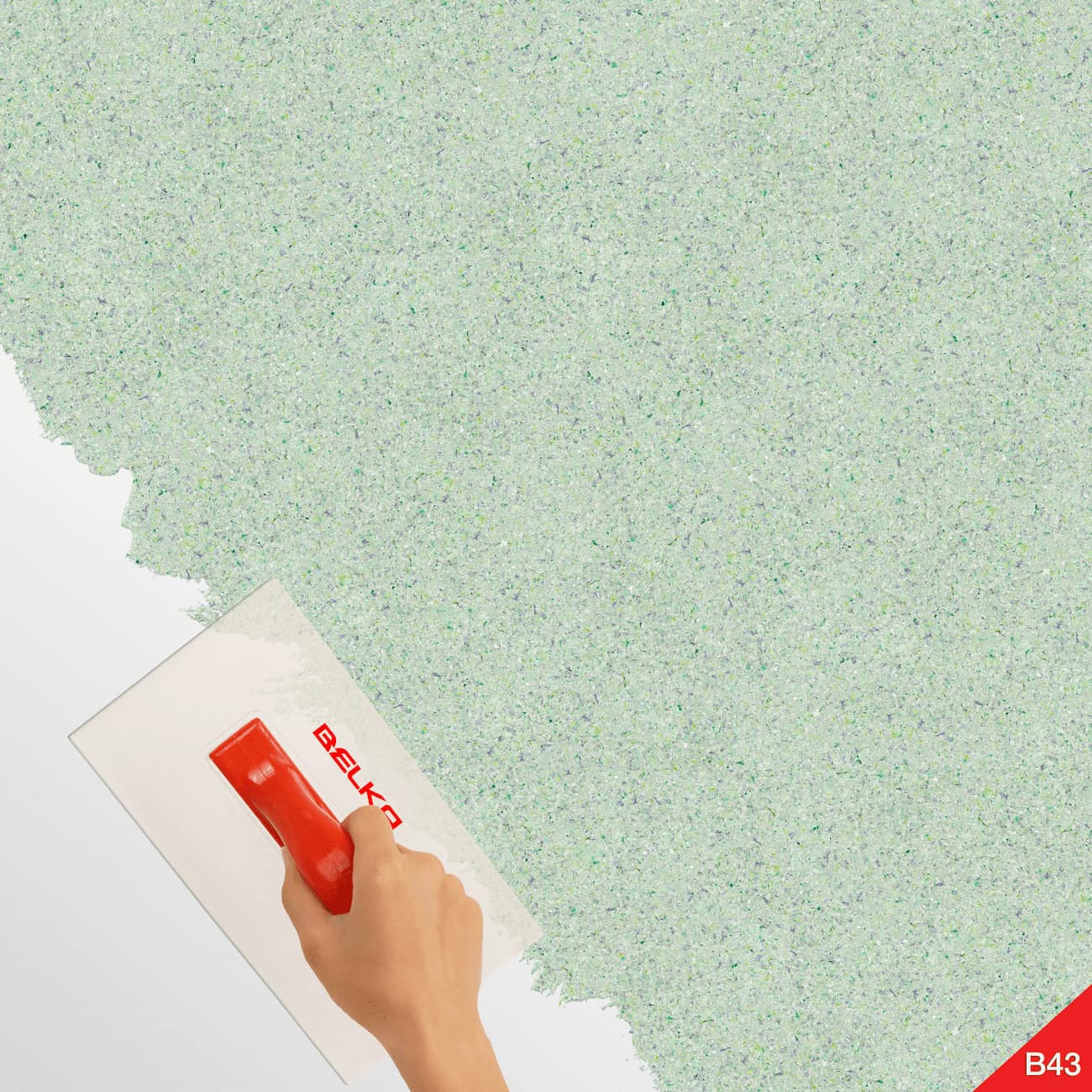 Aplicare cu gletieră a tapetului Belka verde pastel pe perete.