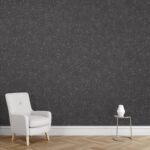 Un interior modern cu fotoliu alb și tapet Belka autoadeziv în tonuri de negru și accente aurii – elegant și izolator fonic și termic.